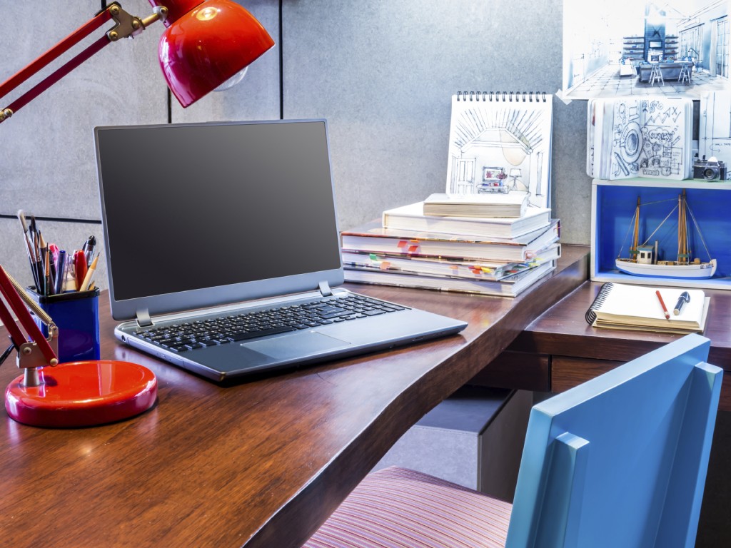 Designer modern home office desk with laptop