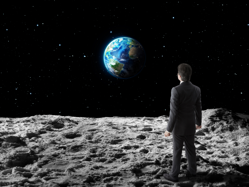 Business man on the moon iStock_000057326888_Small