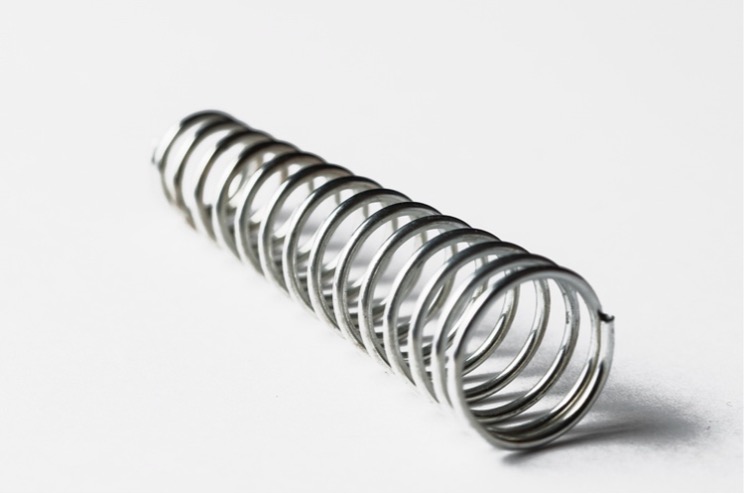 A close-up of a metal spring