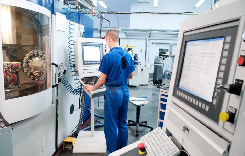 Man using Manufacturing Equipment