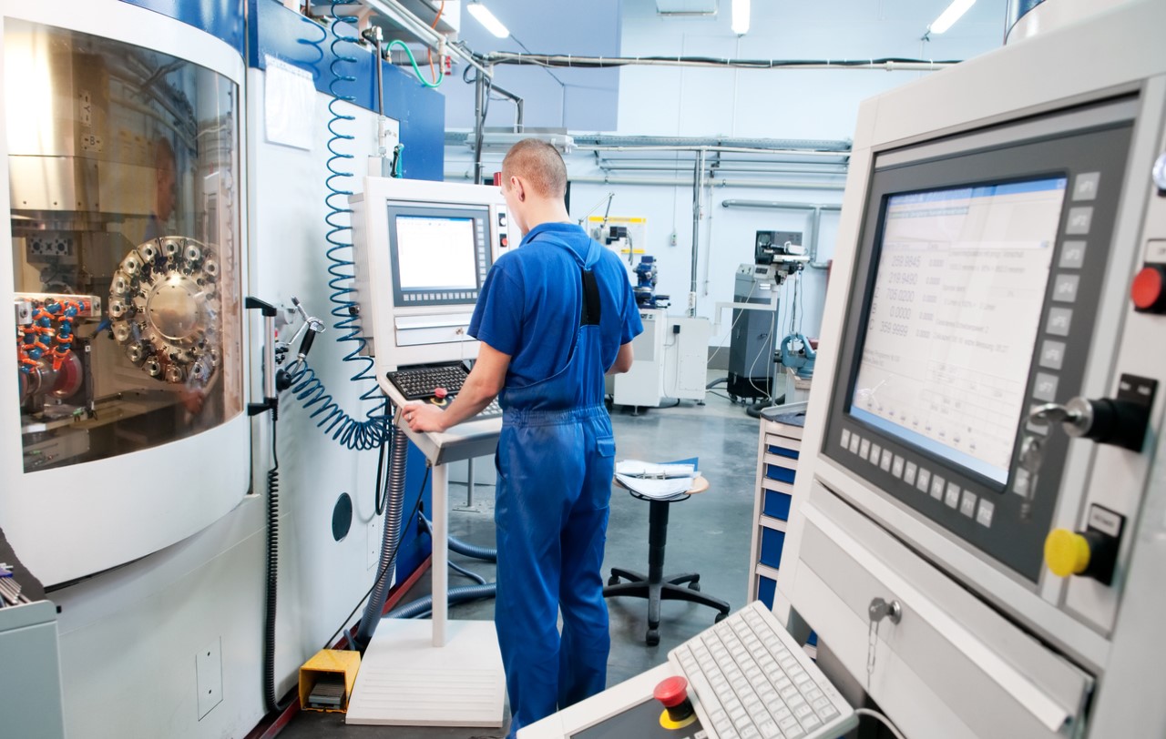 man using manufacturing machinery