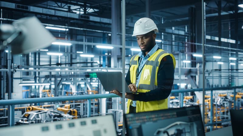 male engineer using laptop