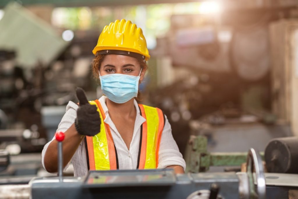 Female engineer thumbs up