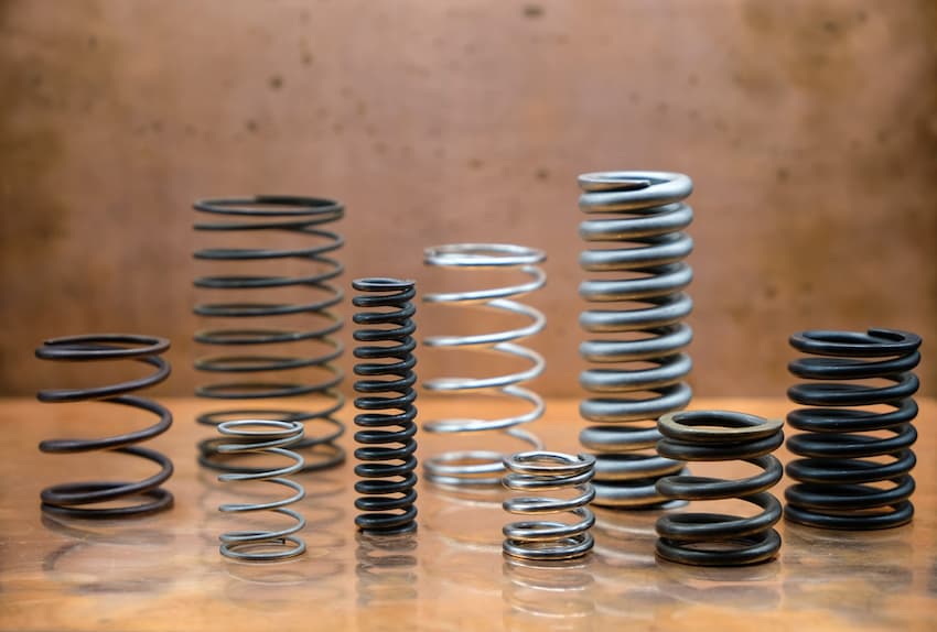 Several metal springs on a table