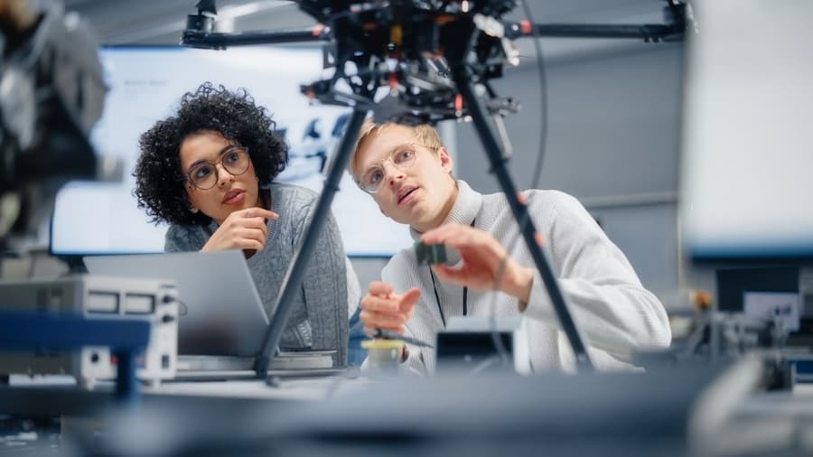 Two people looking at a camera