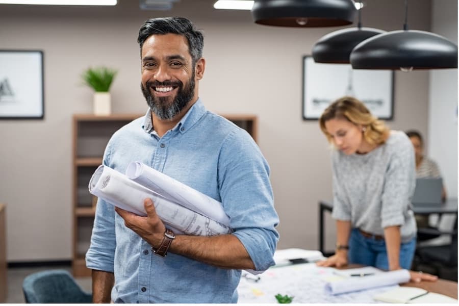 A person holding a rolled up paper